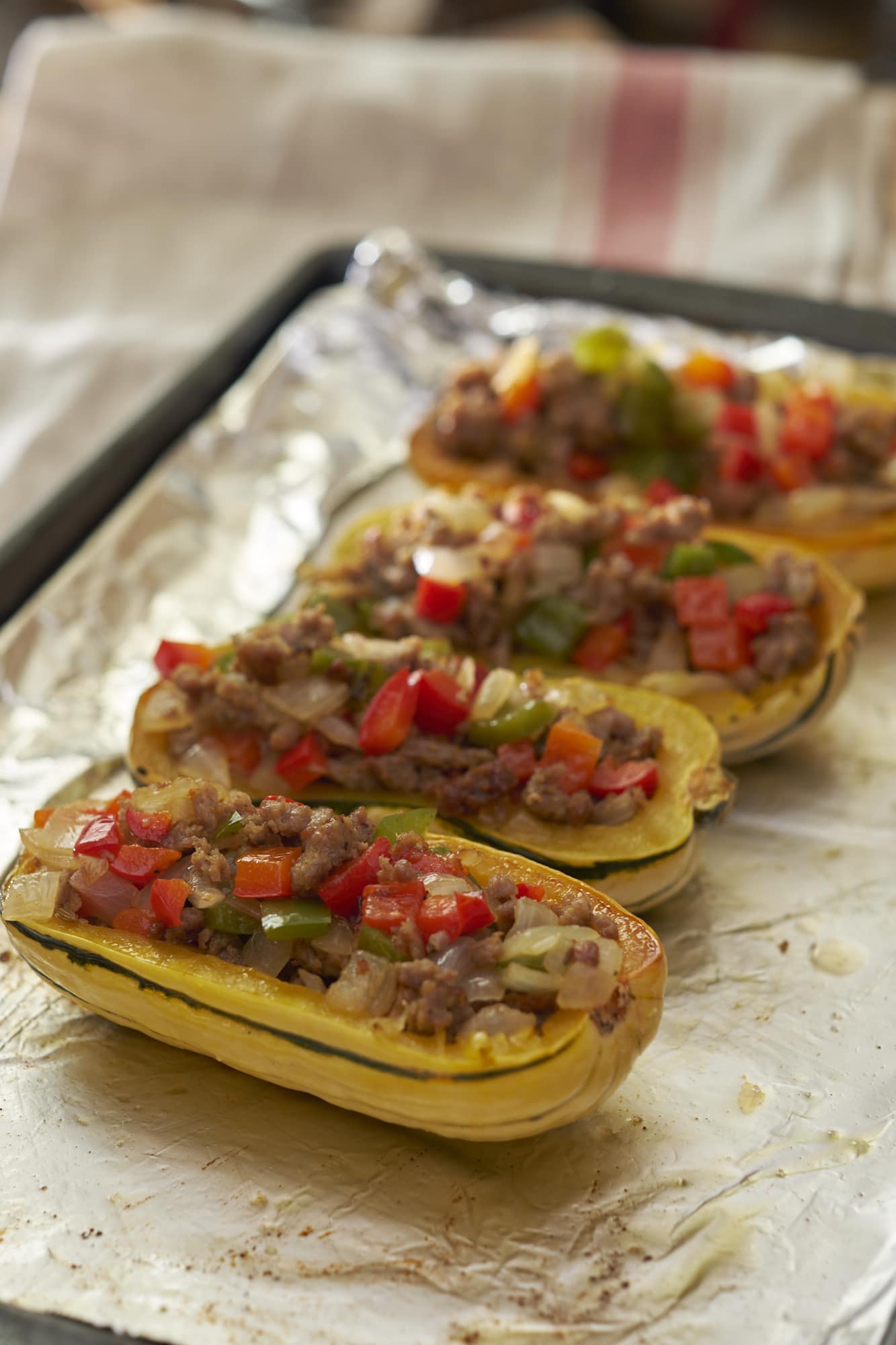 Delicata Squash Stuffed with Sausage Peppers and Onions