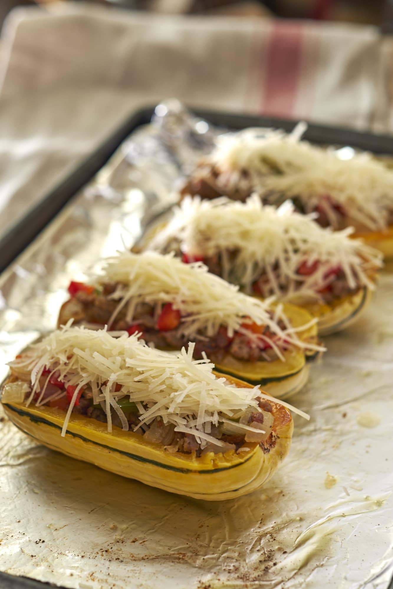 Delicata Squash Stuffed with Sausage Peppers and Onions